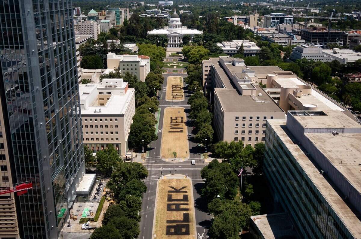 1. The words “Black Lives Matter,” seen in a drone photo Saturday, June 6, 2020, are visible on the median of Capitol Mall in Sacramento. Volunteers helped artist Demetris “BAMR” Washington paint the letters between Sixth and Ninth streets Friday.