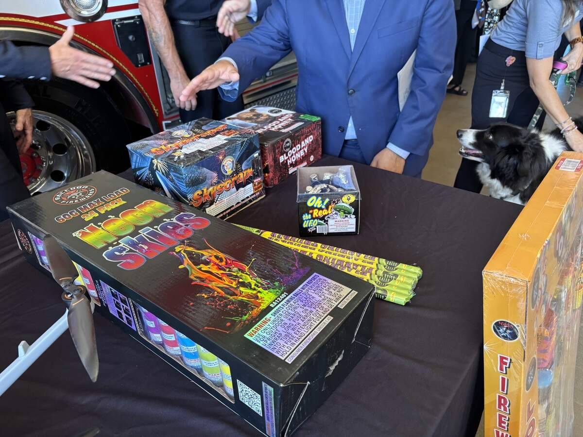 Sacramento Councilmember Eric Guerra gestures toward a display of illegal fireworks during a fireworks safety news conference Tuesday, June 23, 2026, at Fire Station 20 in Old North Sacramento. Officials urged residents to use only state-approved “Safe and Sane” fireworks, which display the California State Fire Marshal’s seal on their packaging.