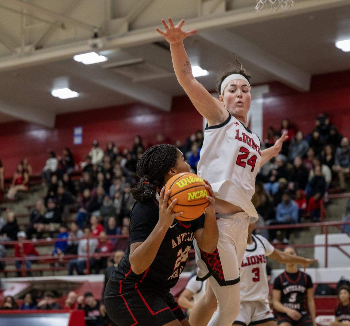 The McClatchy Lions' Daisy Throckmorton (24) defends the Antelope Titans' Londyn Odom (24) in the first half on Friday in Sacramento.