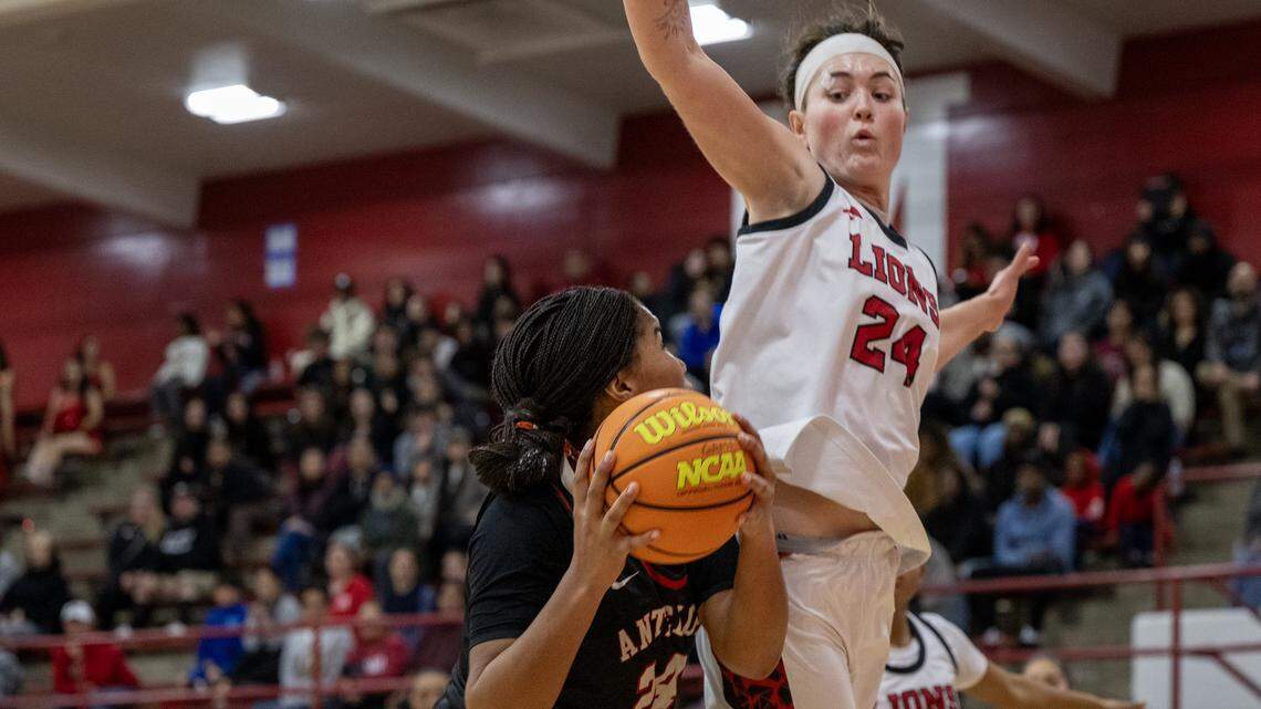 The McClatchy Lions' Daisy Throckmorton (24) defends the Antelope Titans' Londyn Odom (24) in the first half on Friday, Jan. 9, in Sacramento.