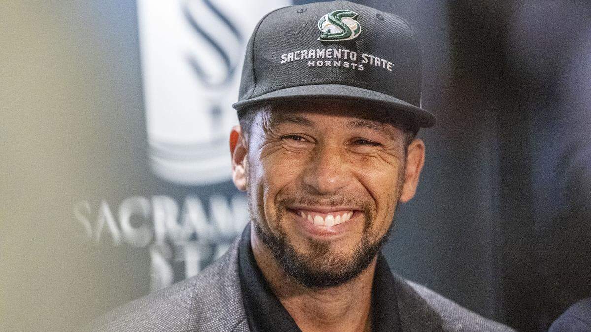 Sacramento State President Luke Wood smiles on Aug. 28 after the Cal Expo board approved an agreement to explore turning its horse racing track into a college football stadium.