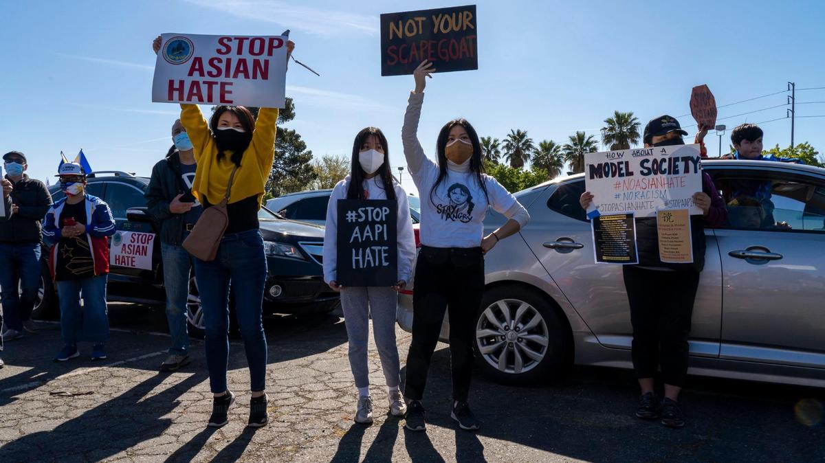 Hundreds of people gathered and held signs while community leaders and local politicians spoke to a crowd, after multiple vehicle parades from around the city converged in a parking lot on Florin Road in South Sacramento for a rally against API hate, Saturday, March 27, 2021, organized by Asian Resources Inc.