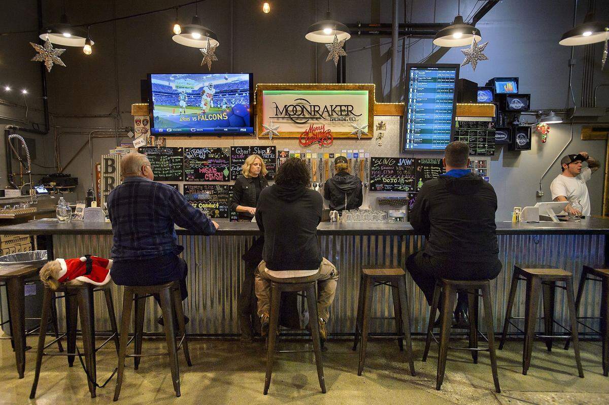 Patrons sit at the bar in the tasting room bar at Moonraker Brewing Company in Auburn in 2016.