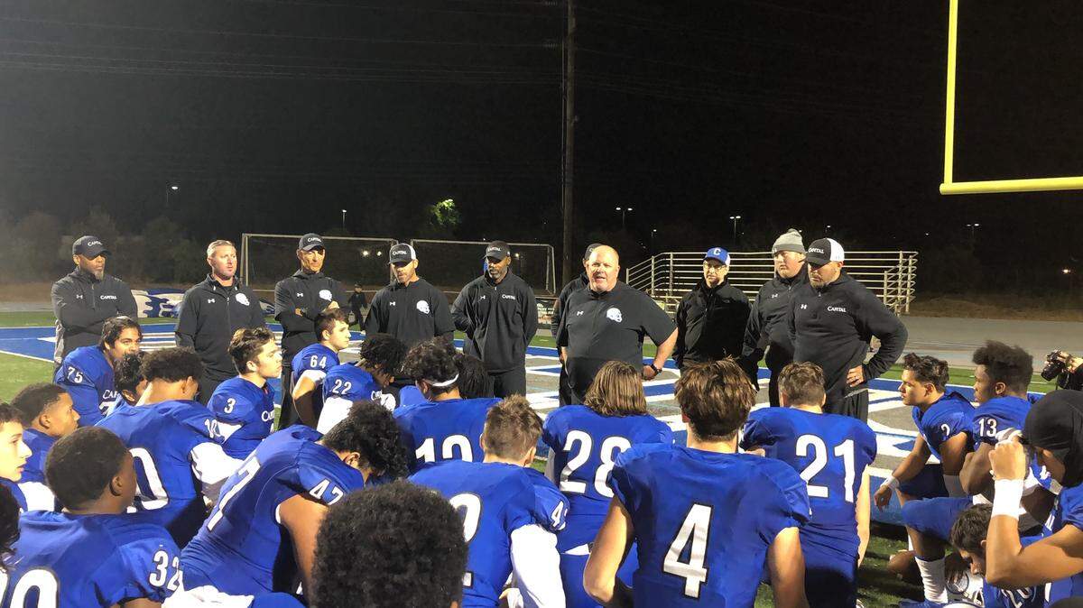 Capital Christian coach Casey Taylor addresses his team after a section quarterfinal win over Antelope on Friday.