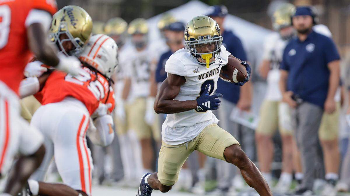 Samuel Gbatu Jr. of UC Davis, seen running during an Aug. 23 game against the Mercer Bears at Cramton Bowl in Montgomery, Alabama, had five catches for 108 yards and a receiving touchdown Saturday as the Aggies defeated the Northern Colorado Bears, 27-16, in Greeley, Colorado.