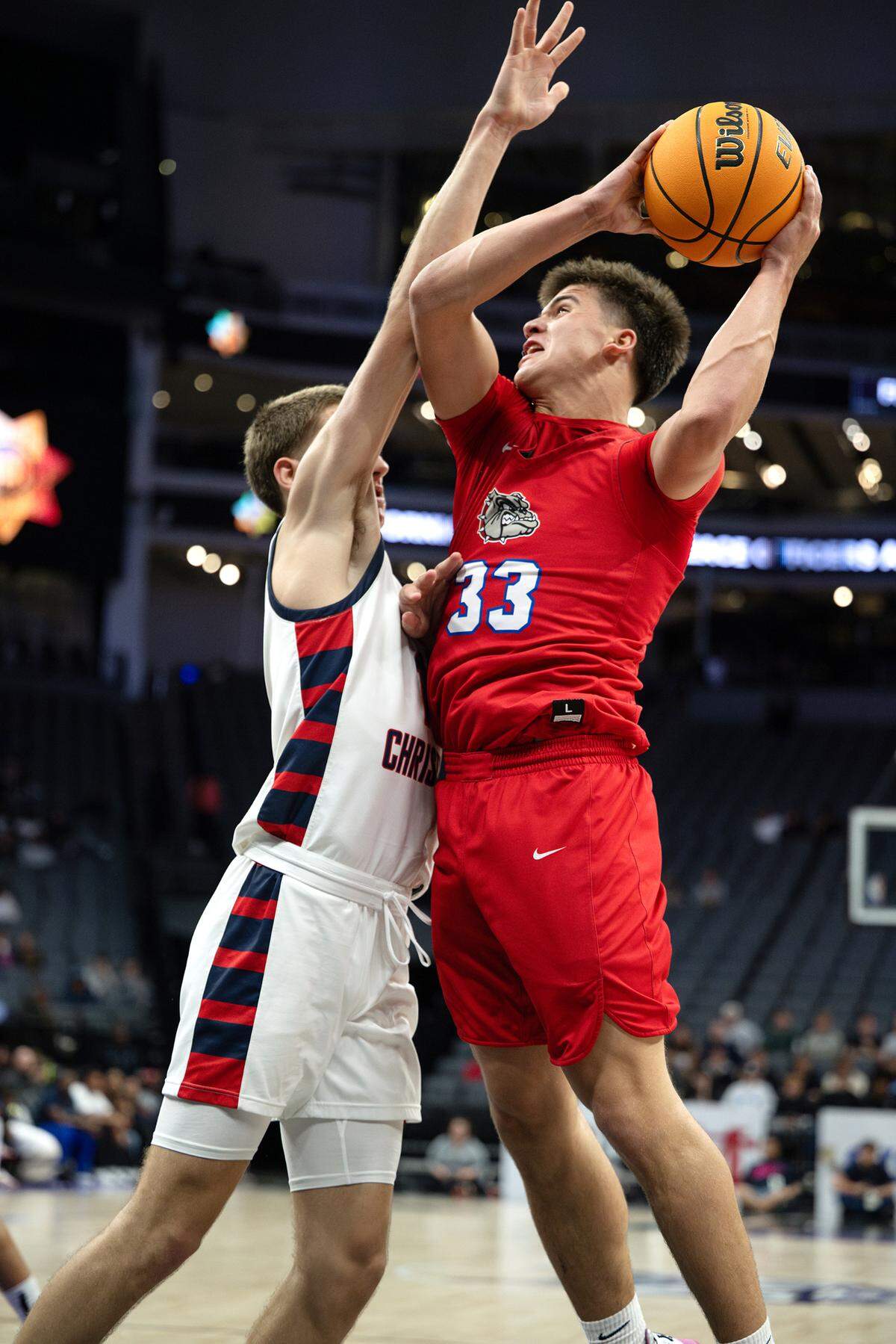 Folsom’s Ryder Lyons attacks the basket as Modesto Christian’s Ry Atkins defends during the Sac-Joaquin Section Division I championship game with Modesto Christian at Golden 1 Center.