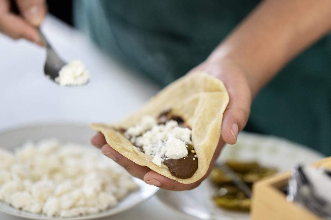 Chef Eríc Martínez of the Crispín Supper Club serves up fresh made tortillas with beans and homemade cheese on Friday, April 24, 2026, in Sacramento.
