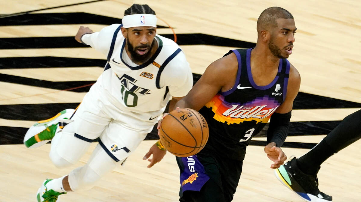 Phoenix Suns guard Chris Paul (3) drives as Utah Jazz guard Mike Conley (10) pursues during the first half of an NBA basketball game, Wednesday, April 7, 2021, in Phoenix. (AP Photo/Matt York)