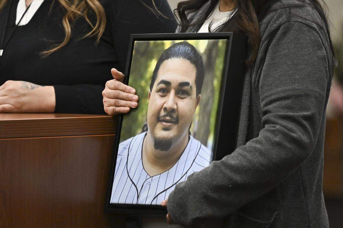 Lupe Melendez-Mendoza holds a photo of her son, Esparto explosion victim Joel Melendez, as she stands alongside Melendez’ wife Maria Melendez in Yolo Superior Court in Woodland on Thursday, April 16, 2026 for the arraignment of those indicted in the explosion.