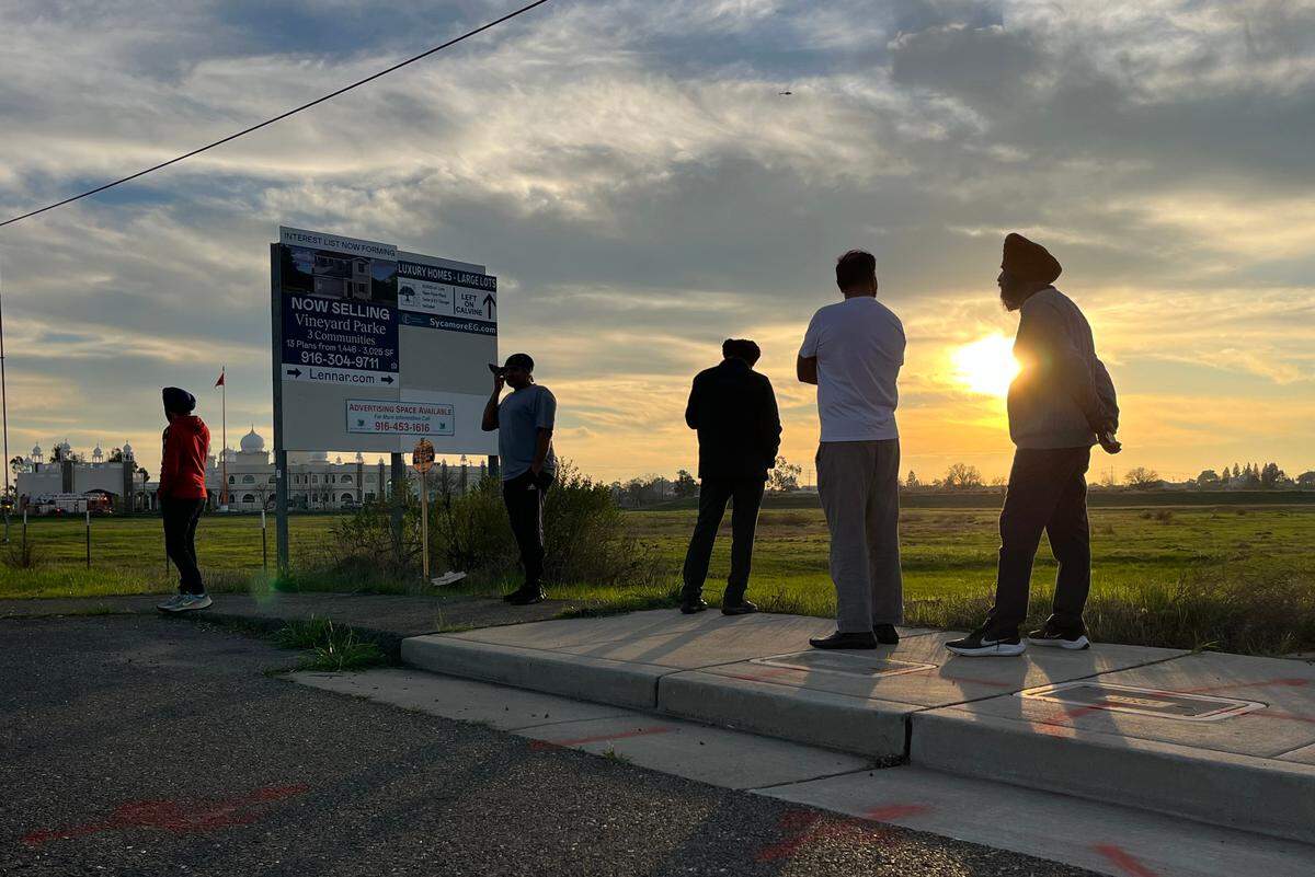 Members of the Gurdwara Sacramento Sikh Society, a temple in Sacramento County’s Vineyard neighborhood, wait for news about about explosions and a fire at the temple on Monday.