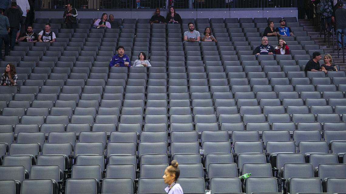 Sacramento Kings fans sit in the stands at Golden 1 Center on Wednesday, March 11, 2020, after the NBA postponed the Kings-Pelicans game and suspended the season. Earlier in the day, Utah Jazz player Rudy Gobert tested positive for coronavirus.