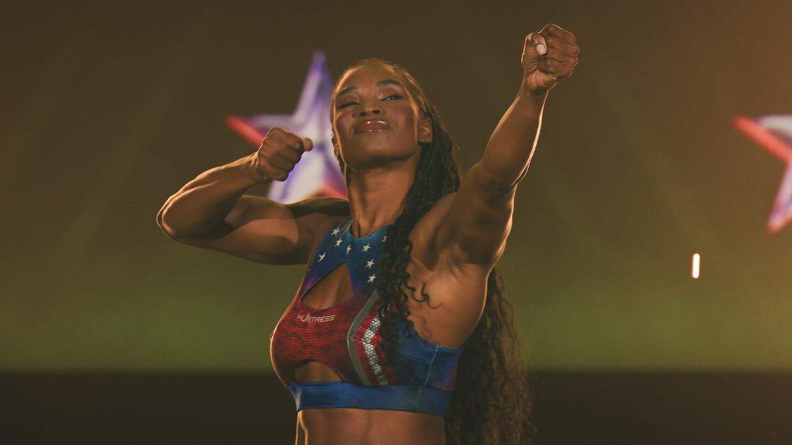 Sydney Hunter, 29, a former sprinter at St. Francis High School, pantomimes a bow and arrow in a still from the show American Gladiator. Hunter, who will go by the nickname “Huntress” in the show, will be one of 16 competitors on the show which premieres on Friday, April 17, 2026.