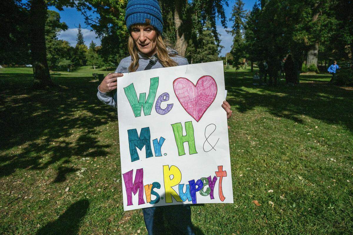 Kimberly Mulligan, whose son was a student in Jeanine Rupert’s class at Phoebe Hearst Elementary School last year, holds a sign made by her daughter Ellie — also a student there now — during a student walkout at East Portal Park in Sacramento on Monday. The protest was in response to the removal of sixth-grade teachers Rupert and Mark Henrikson.