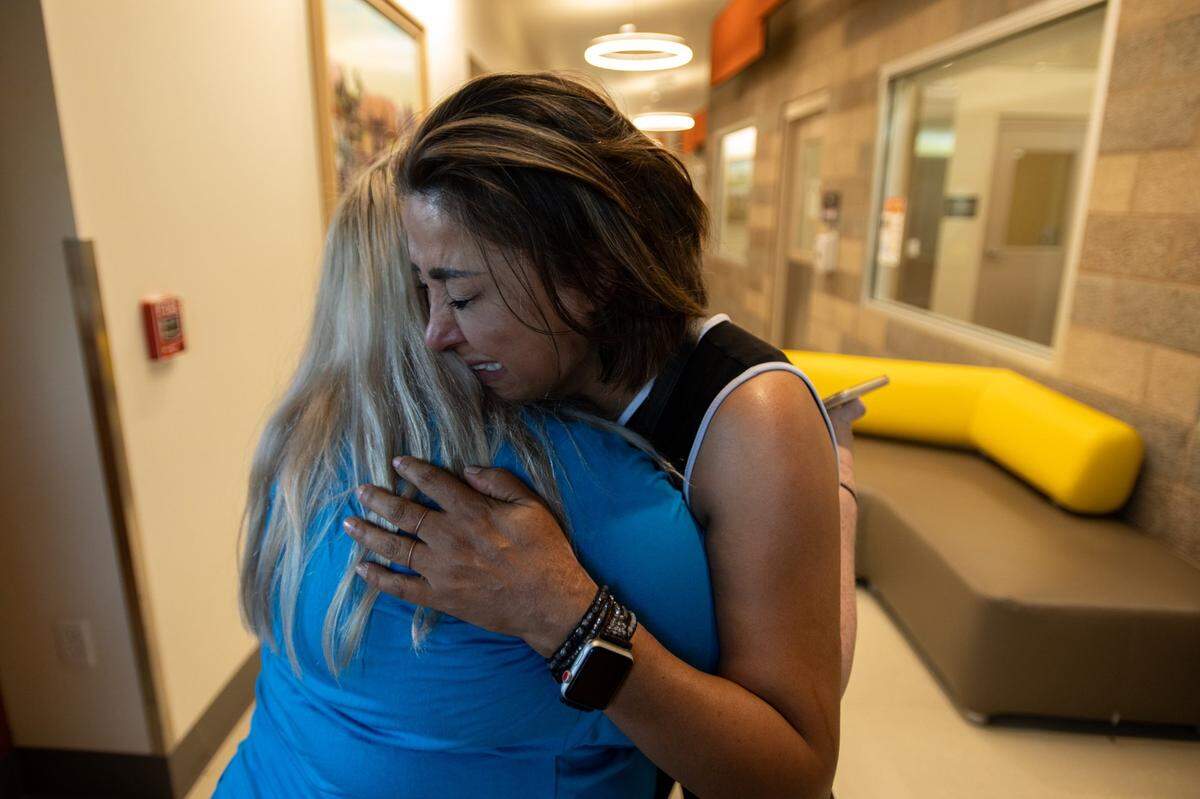 Faryal Kabir cries as she hugs her friend Aimie McIrvin after she was denied visitation with her dog Zeus at the Elk Grove Animal shelter in Elk Grove on Friday. Elk Grove Fearing officials may euthanize the German shepherd puppy over the weekend, a lawyer says he and the dog’s owners plan to seek release of Zeus before he can be killed.