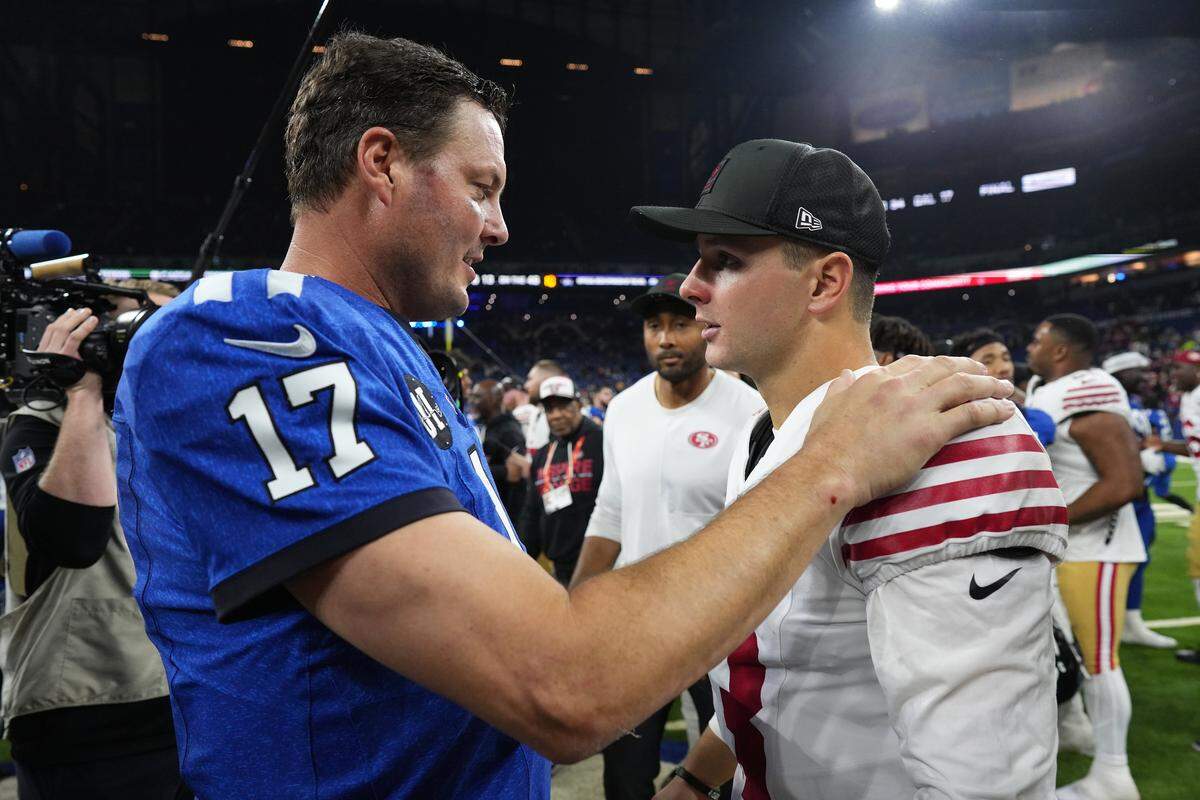 INDIANAPOLIS, INDIANA - DECEMBER 22: Philip Rivers #17 of the Indianapolis Colts and Brock Purdy #13 of the San Francisco 49ers shake hands after the game at Lucas Oil Stadium on December 22, 2025 in Indianapolis, Indiana. (Photo by Dylan Buell/Getty Images)