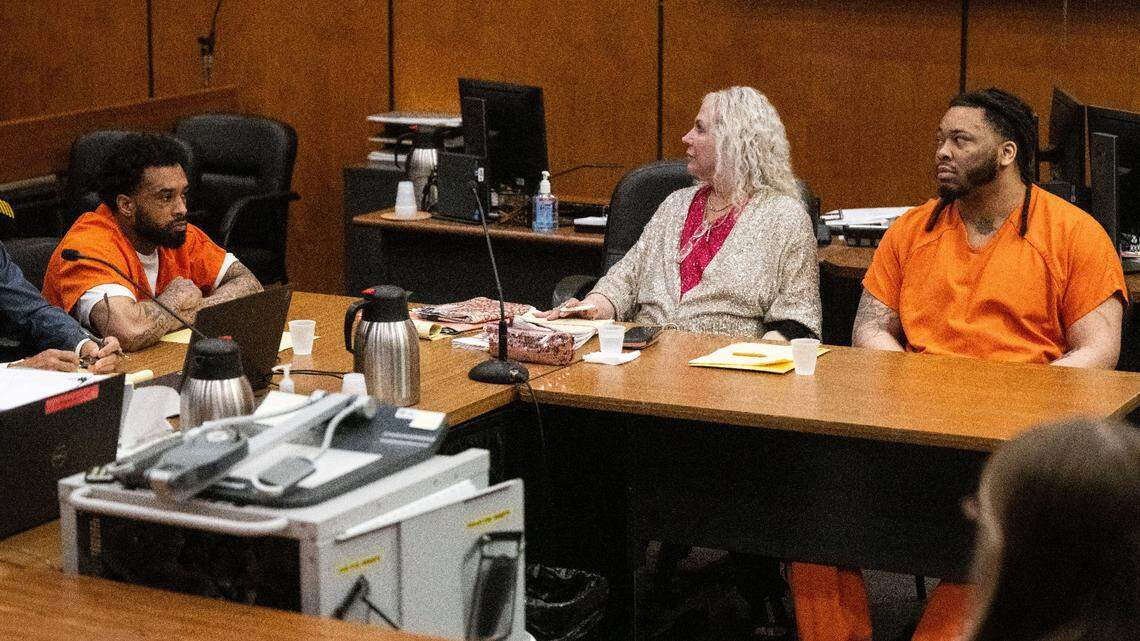 Defendant Dandrae Martin, right, and his attorney Linda Parisi look toward the gallery as people cry when the murder charges are dismissed against Smiley Martin, who died in jail in June, during a preliminary hearing in Sacramento Superior Court on Aug. 16, 2024. Mtula Payton, who is also charged in the 2022 gang-related gun fight on K Street, sits at left. Both returned to court this Friday.