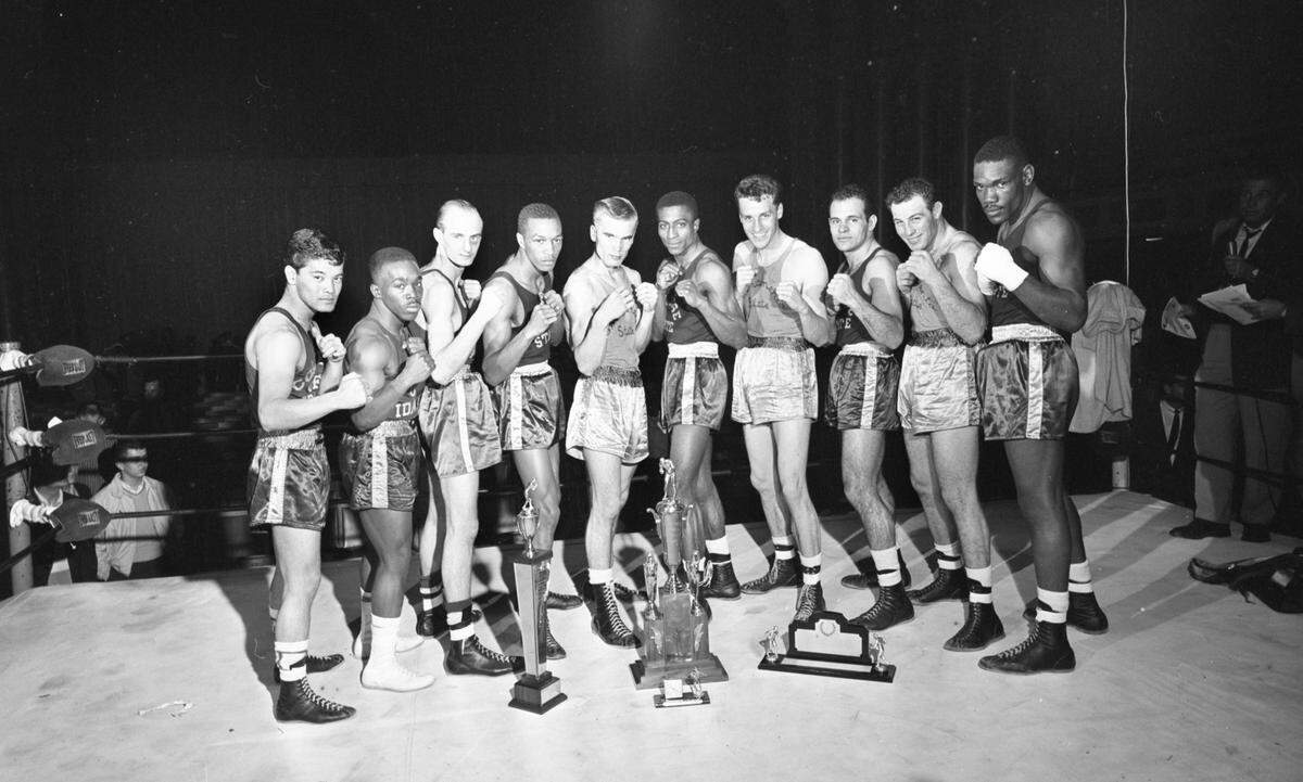 Sacramento State’s Norm Tavalero, second from right, stands among the final Pacific Coast Intercollegiate boxing champions in 1960 at Memorial Auditorium in Sacramento. Teammates George Waggoner and Terry Smith joined champions from San Jose State, Washington State and the College of Idaho.