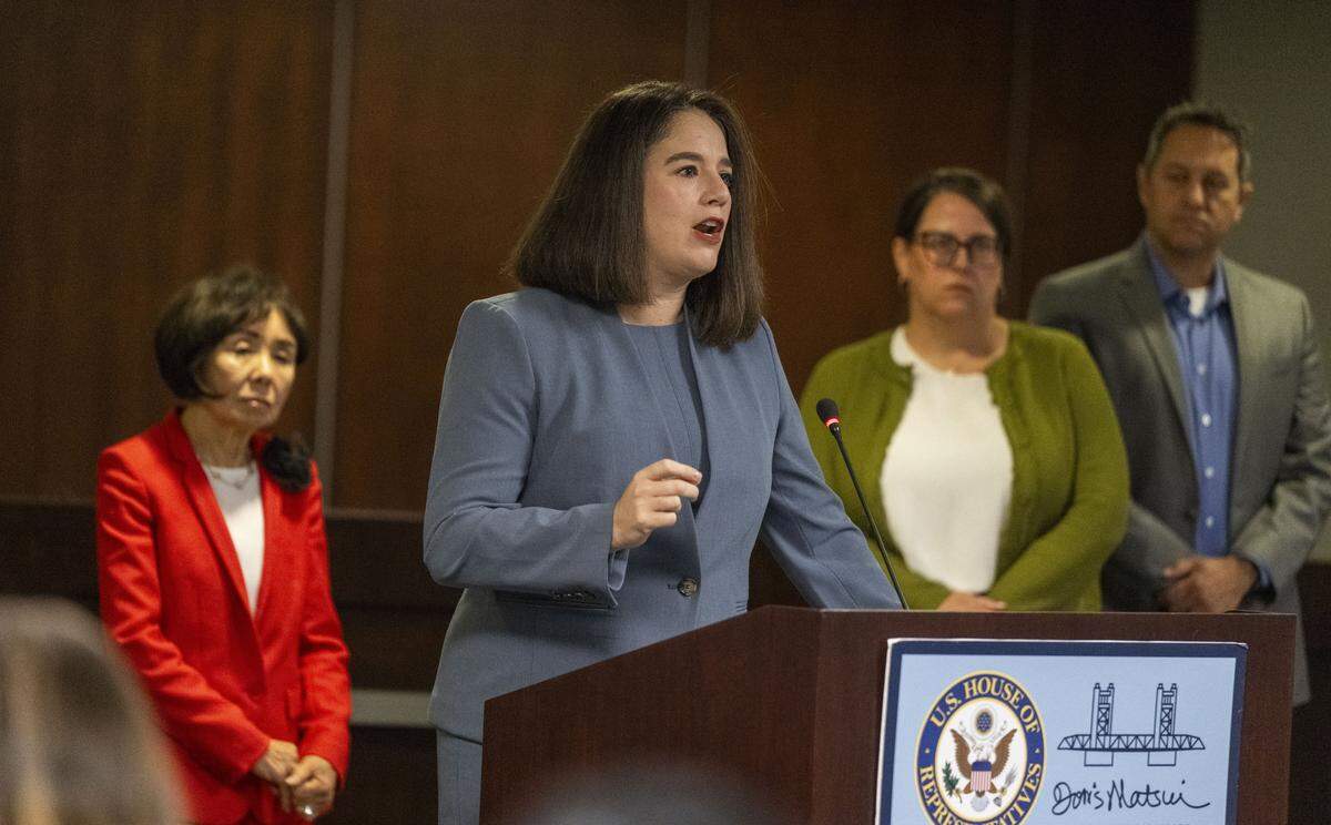 Jessica Altman, executive director of Covered California, speaks during a Friday news conference at her Sacramento office held by U.S. Rep. Doris Matsui, D-Sacramento, left, about the congressional stalemate over health care that has led to the federal shutdown. 