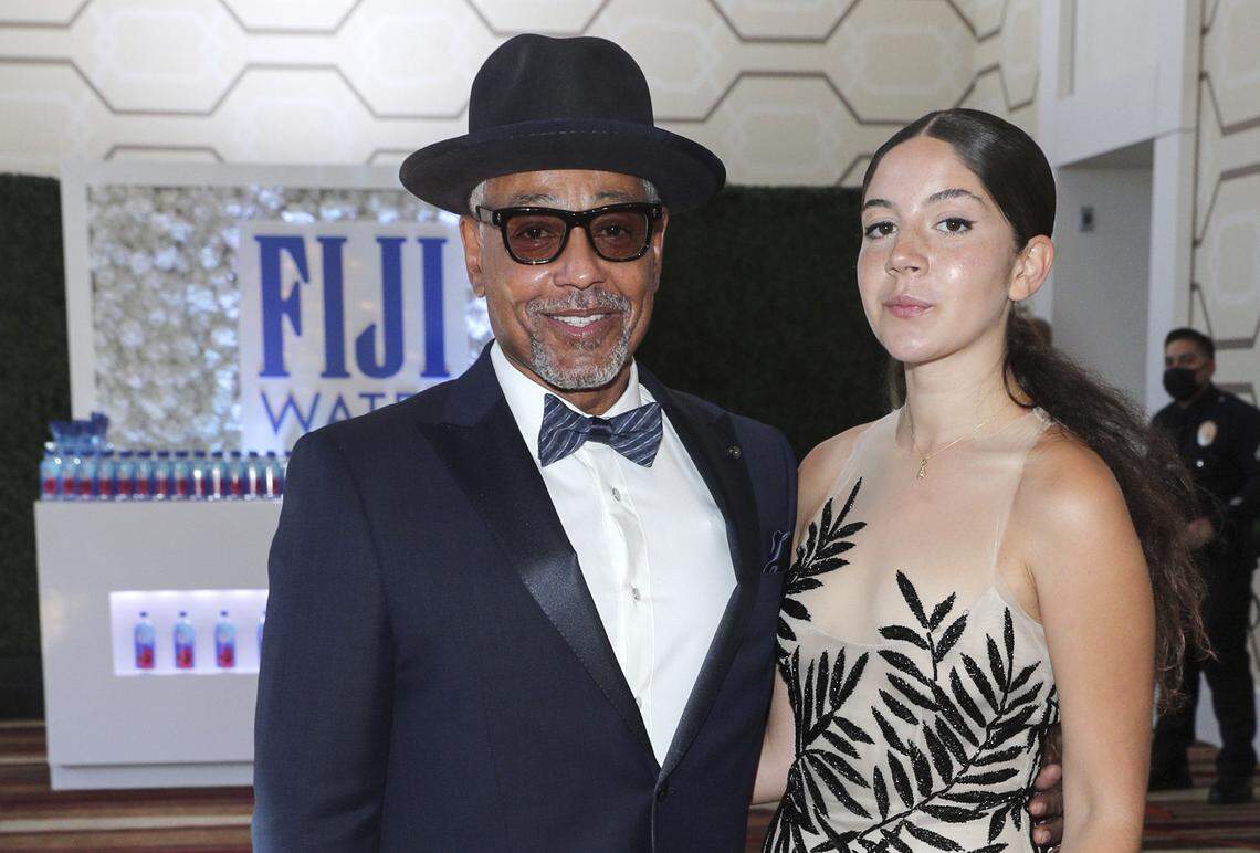 A display for Fiji water appears behind the arrival of actor Giancarlo Esposito and daughter Kale at the Emmy Awards in Los Angeles in 2021. The L.A.-based brand, owned by the Resnick family’s Wonderful Co., bottles its water on its namesake island in the South Pacific.