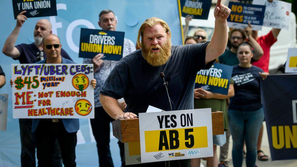 Uber driver and organizer Jeff Perry of Sacramento speaks in supporter of Assembly Bill 5 at the California state Capitol on Wednesday, Aug. 28, 2019. The bill would force “gig economy” employers to treat independent contractors as employees.