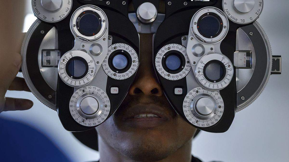 Jamaal Johnson of Sacramento gets his eyes examined during the annual CareForce health fair at Cal Expo in Sacramento on Friday, September 22, 2017. Medical professionals volunteered to give free medical services to anyone during this event.