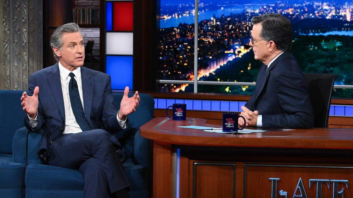 California Gov. Gavin Newsom speaks with Stephen Colbert on his CBS late-night talk show in New York on Tuesday. Newsom used the appearance to promote Proposition 50 and accuse President Donald Trump of authoritarian tactics ahead of the 2028 election.