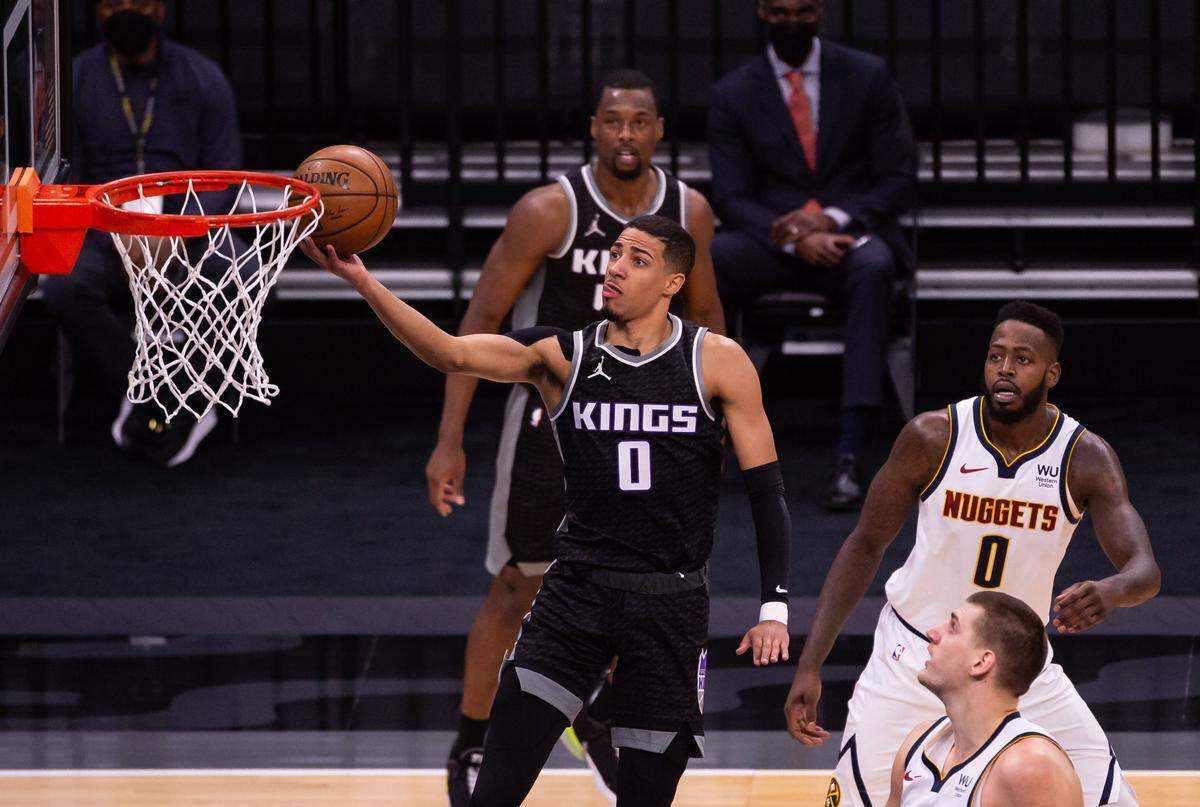 Kings guard Tyrese Haliburton (0) scores on a layup in the first period against the Denver Nuggets on Feb. 6 at Golden 1 Center in Sacramento.
