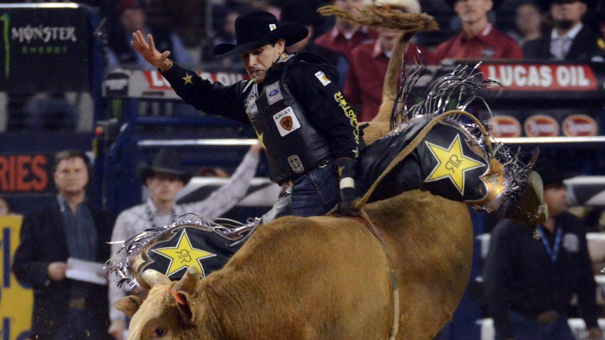 Joao Ricardo Vieira rides the bulll Grandpa Joe in Round 1 of the PBR Iron Cowboy Bull Riding competition at AT&T Stadium in Arlington in 2015.