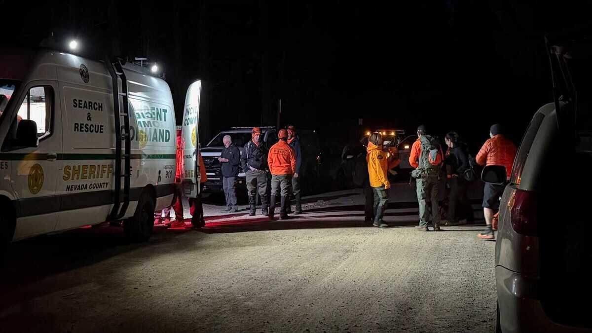 Search and rescue personnel gather near the command post at Little Truckee in the Tahoe National Forest on Sunday, June 28, 2026, as they prepare to search for a missing 83-year-old hiker. Ground searchers located the woman before overnight temperatures were expected to fall into the mid-30s, and she was reunited with her family without injuries.