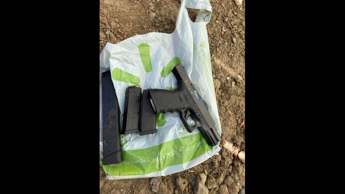 A stolen Glock handgun and an extended magazine were recovered from a backyard on West El Dorado Drive in Woodland, California, after a passenger fled a traffic stop Sunday, July 24, 2022. Woodland police found the unidentified passenger inside a garbage can on the side of the home. The driver was also arrested for alleged warrants and suspicion of fleeing.