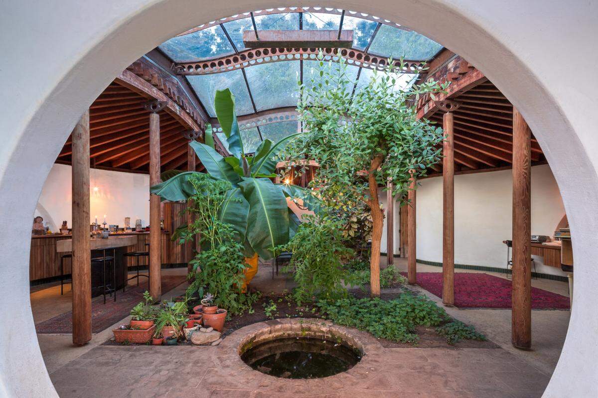 The 30-acre Big Sur estate of architect Mickey Muennig — perched 1,500 feet above the ocean and featuring a home built into the mountainside with an arched skylight, sod garden roof and a separate glass house — has hit the market for $6.95 million.