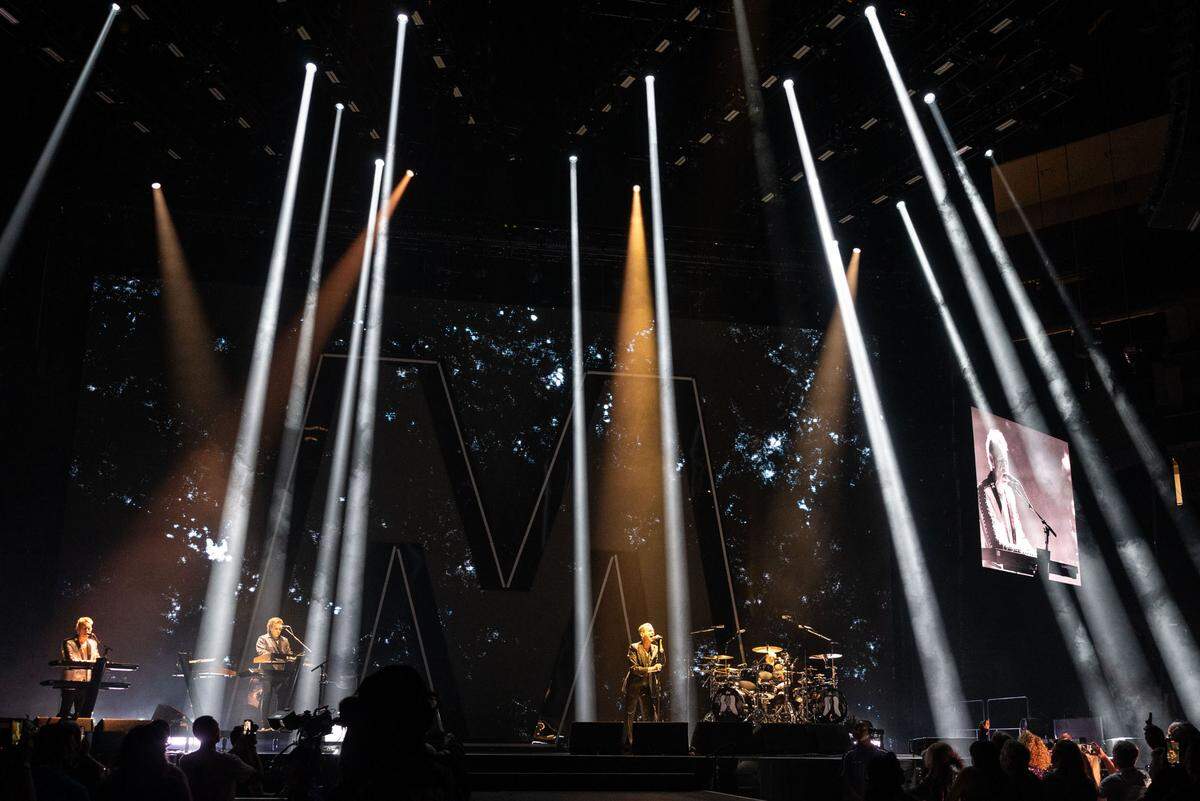 Vocalist Dave Gahan, center, and songwriter-guitarist-keyboardist Martin Gore, far left, the two remaining original members of Depeche Mode, play the sold-out first show at Golden 1 Center on Thursday, March 23, for their “Memento Mori” world tour.