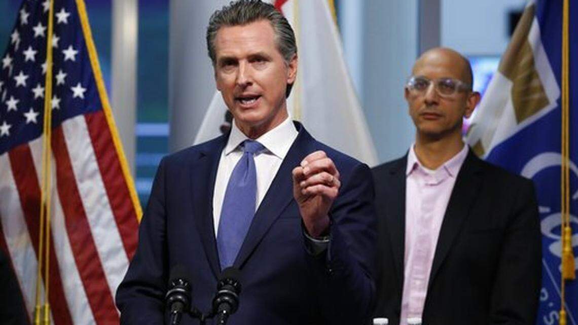 California Gov. Gavin Newsom give an update to the state’s response to the coronavirus, at the Governor’s Office of Emergency Services in Rancho Cordova Calif., Tuesday, March 17, 2020. At right is California Health and Human Services Agency Director Dr. Mark Ghaly.