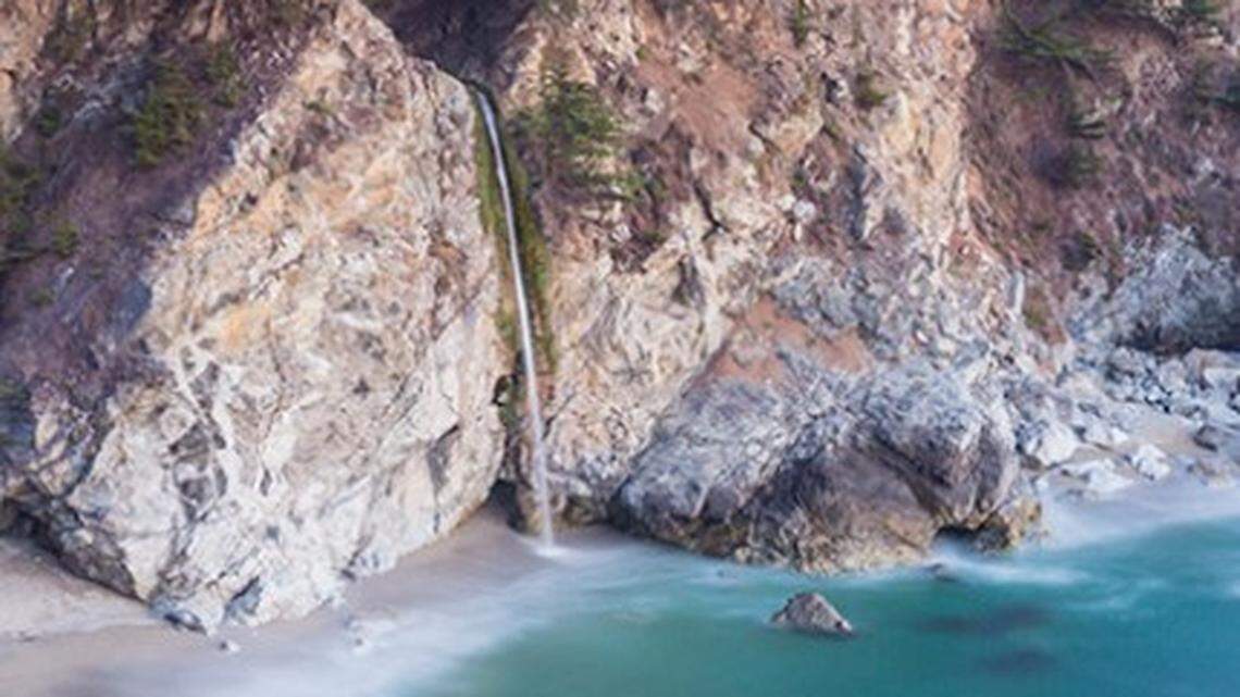 A waterfall plunges 80 feet to the beach at Julia Pfeiffer Burns State Park, which will remain closed until further notice because of storm damage.