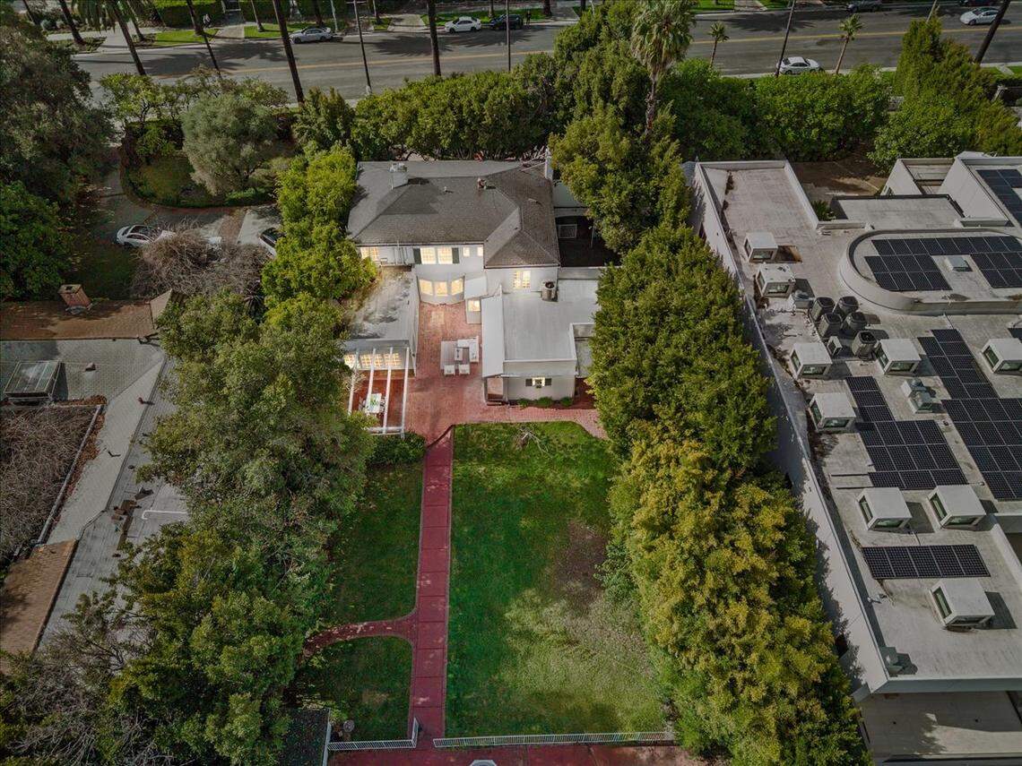 The Beverly Hills home sits on more than a half acre with a hidden tennis court.