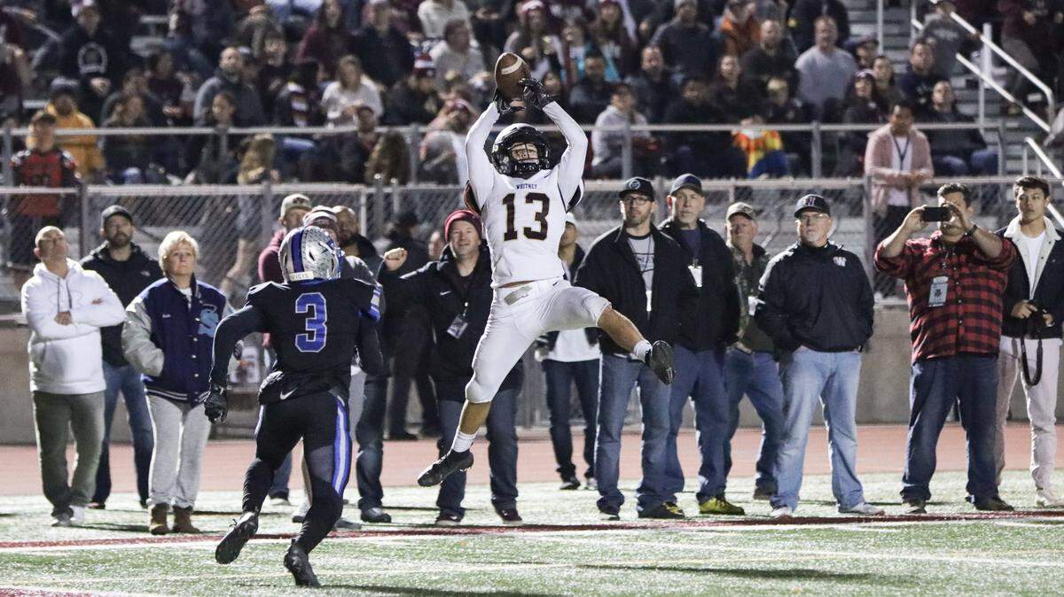 Nick Tawney pulls down a pass during Whitney’s 28-6 upset win over Rocklin on Friday.