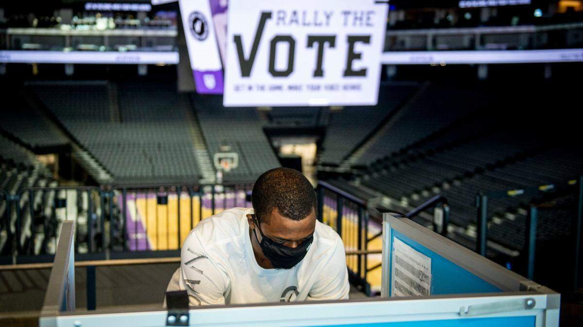 Sacramento Kings forward Harrison Barnes casts his ballot for the 2020 election at Golden 1 Center in Sacramento on Saturday, Oct. 24, 2020. Golden 1 Center opened as a voting center Saturday in partnership with the Sacramento County Office of Voter Registration and Elections and SacRT, which is offing free rides on Oct. 24 and Nov. 3 to help residents make it to the polls.
