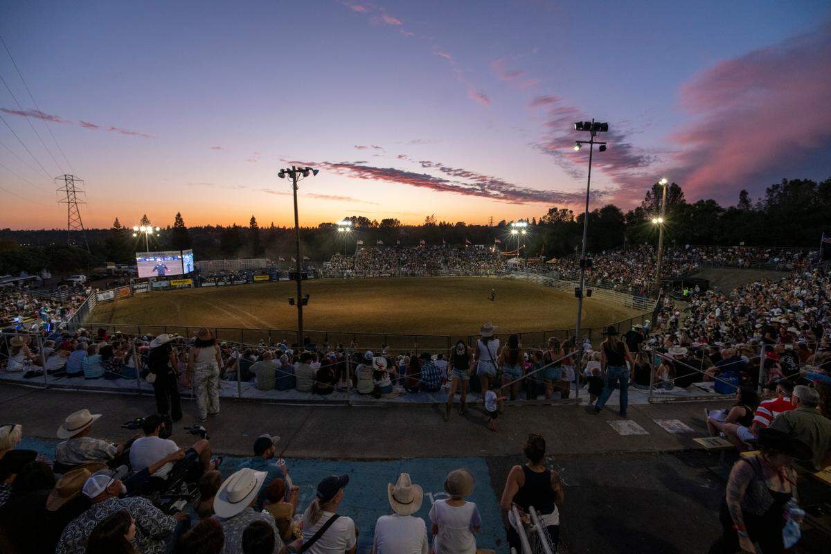 The sun sets on the sold-out Folsom Pro Rodeo on Thursday.
