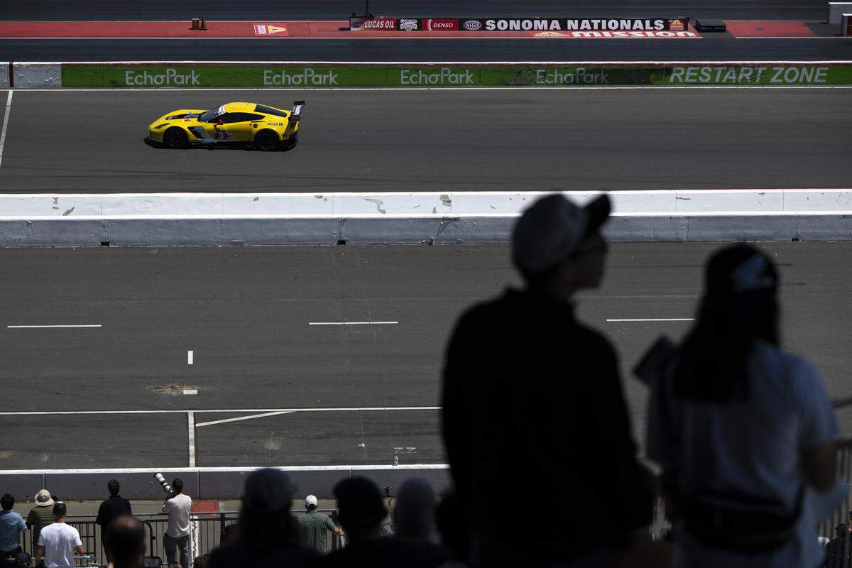 Fans watch as Tom Mueller drives a 2014 Chevrolet Corvette C7R during the Velocity Invitational at Sonoma Raceway in Sonoma on Saturday, May 30, 2026.