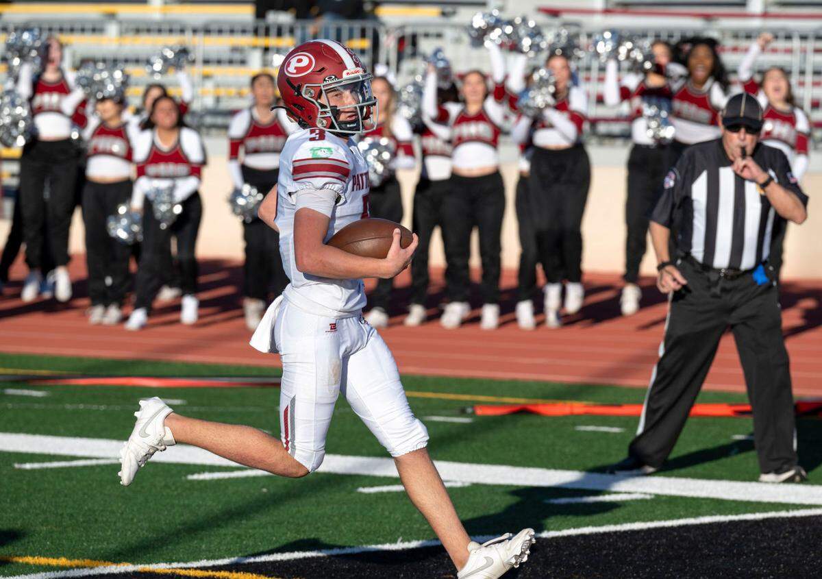 Patterson Tigers’ quarterback Max Medina (3) coasts into the end zone for a first-quarter touchdown against the Twelve Bridges Raging Rhinos during the Sac-Joaquin Section Division IV championship game at Hughes Stadium in Sacramento on Friday, Nov. 29, 2024.