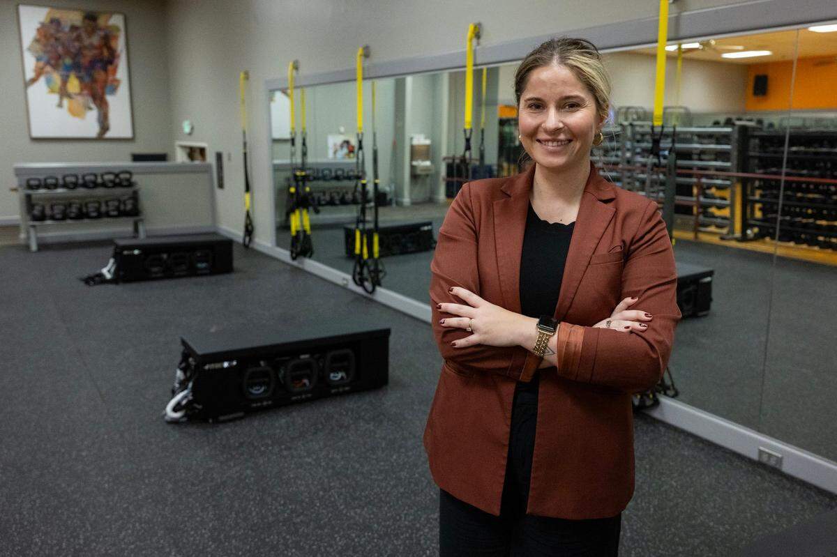 Sierra Bamsey, YMCA director of marketing for superior California, stands in the new exercise room at the Capital YMCA in downtown Sacramento last month. Formerly the Capital Athletic Club – a longtime fitness and networking center for Capitol insiders and politicians – the rebranded facility will hold a grand opening celebration on Tuesday.