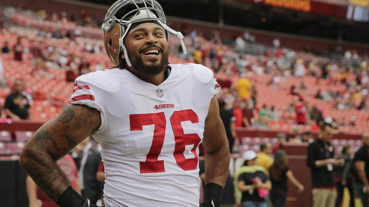 San Francisco 49ers offensive tackle Garry Gilliam (76) stands on the sidelines before an NFL football game against the Washington Redskins in Landover, Md., Sunday, Oct. 15, 2017. (AP Photo/Mark Tenally)