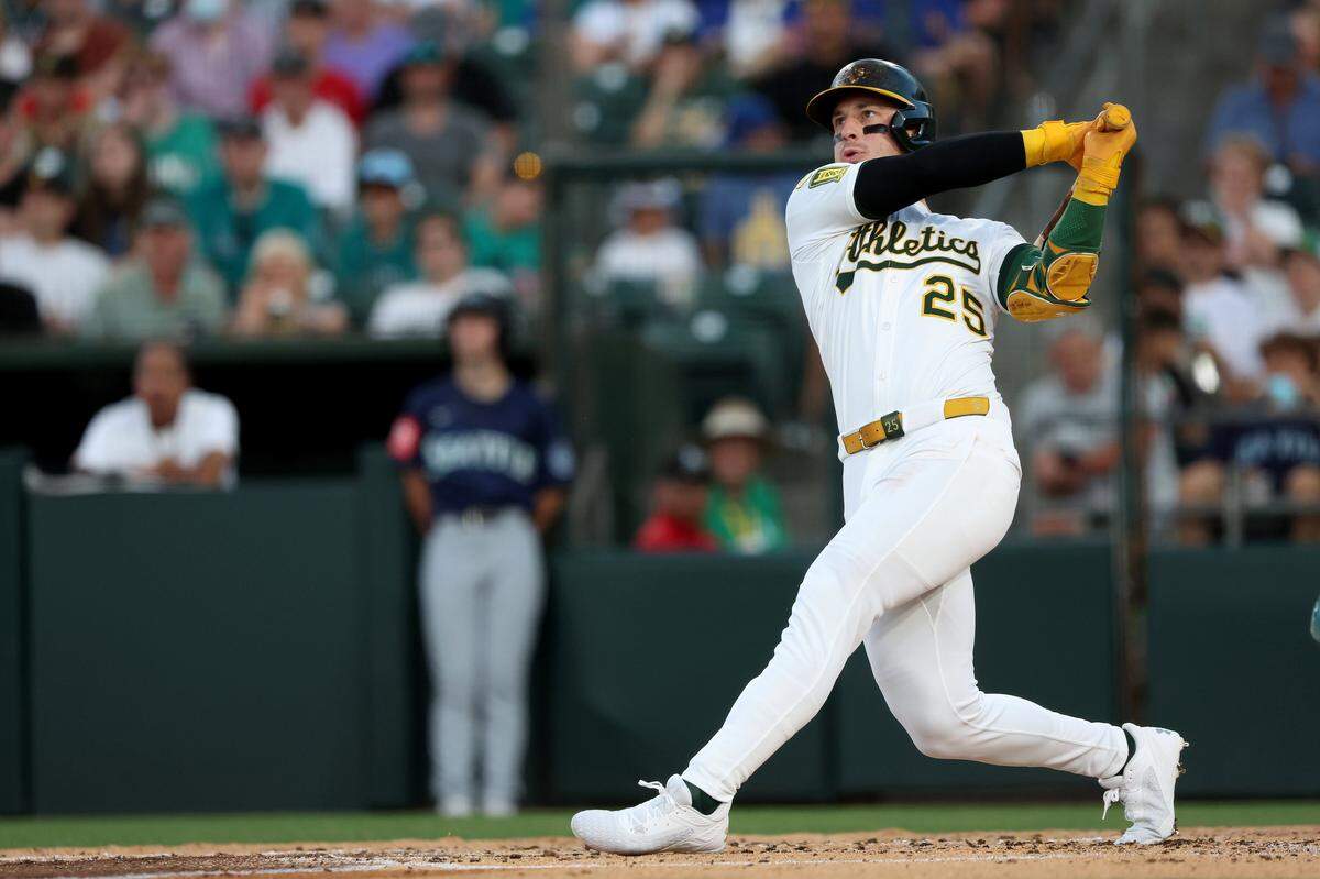 Athletics designated hitter Brent Rooker watches the ball after hitting a three-run home run against the Seattle Mariners during the third inning Tuesday at Sutter Health Park in West Sacramento.