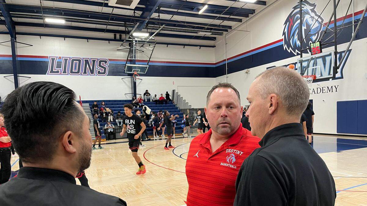 Destiny Christian Academy coach Mike Lorente, middle, said his Lions are “hell bent” on winning a section championship, as the Lions defeated Antelope on Friday night in Sacramento County to advance to the CIF Sac-Joaquin Section boys basketball semifinals.