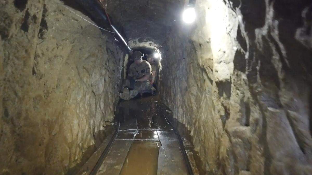 This March 2020 image from video provided by the U.S. Border Patrol’s San Diego Tunnel Team shows an agent in a tunnel under the Otay Mesa area of San Diego, Calif. Federal authorities seized a panoply of narcotics inside the newly discovered underground passage connecting a warehouse in Tijuana with south San Diego. The bust of $30 million worth of street drugs was also notable for its low amount of fentanyl - about 2 pounds.