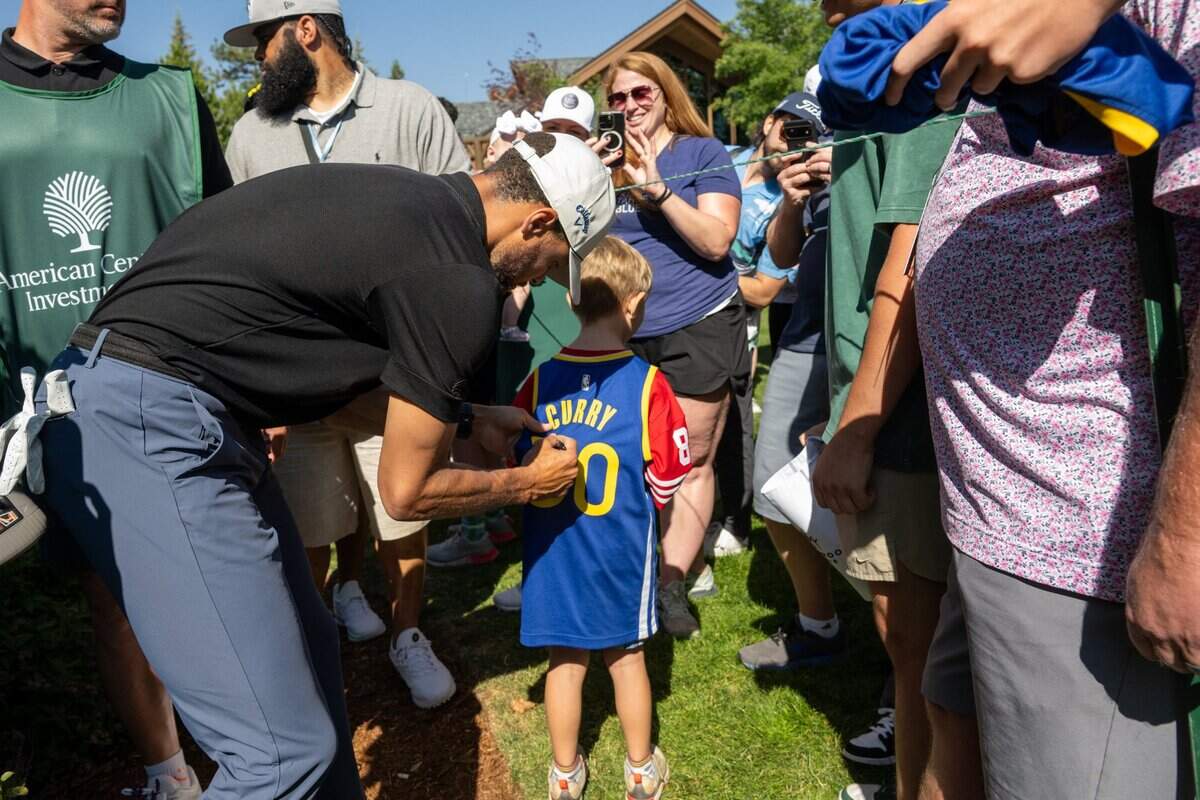 The Golden State Warriors’ Stephen Curry signs autographs during the American Century Championship celebrity golf tournament at Edgewood Tahoe Resort in Stateline, Nev., on Friday, July 11, 2025.