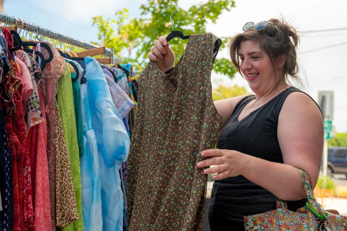 A customer finds a dress at QueerShoppe in Sacramento’s Oak Park neighborhood earlier this month.