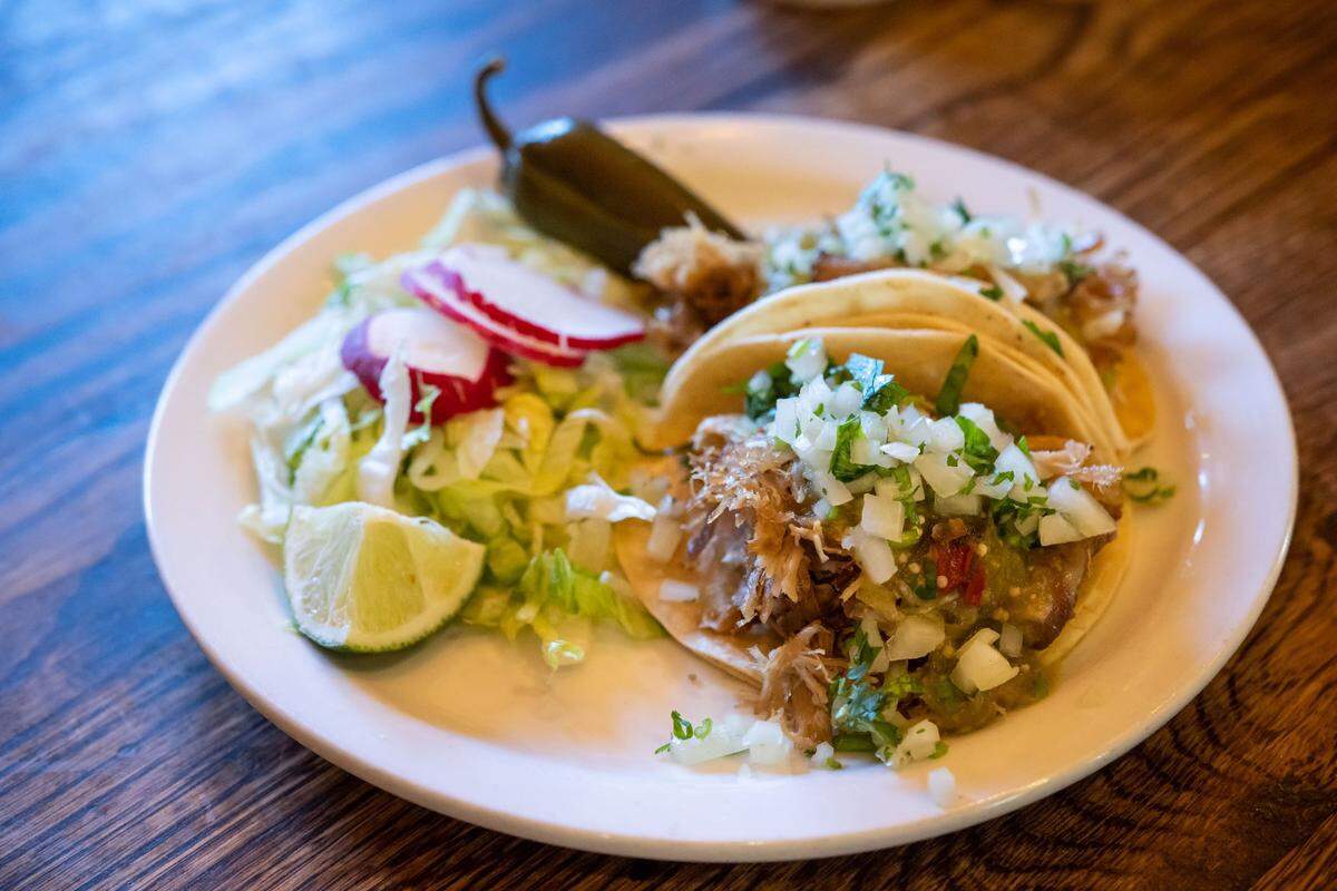 Maria’s Cantina’s carnitas tacos sit ready to eat in the dining room at the Sixth Street restaurant in Woodland.