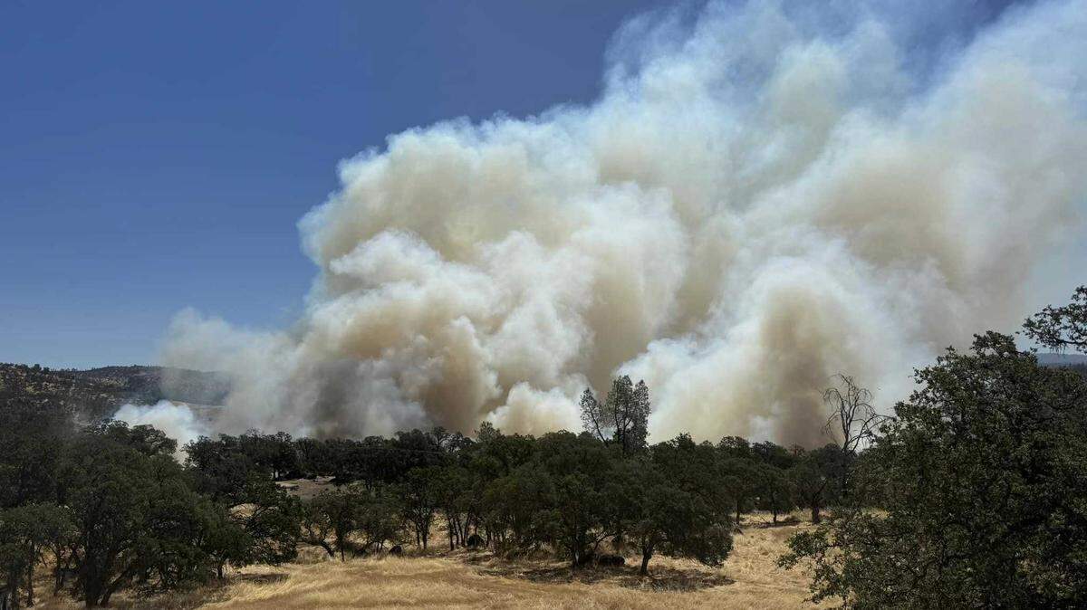 Smoke was billowing from the Thompson Fire burning Tuesday, July 2, 2024, and prompting evacuation orders in Butte County, near Oroville, California.