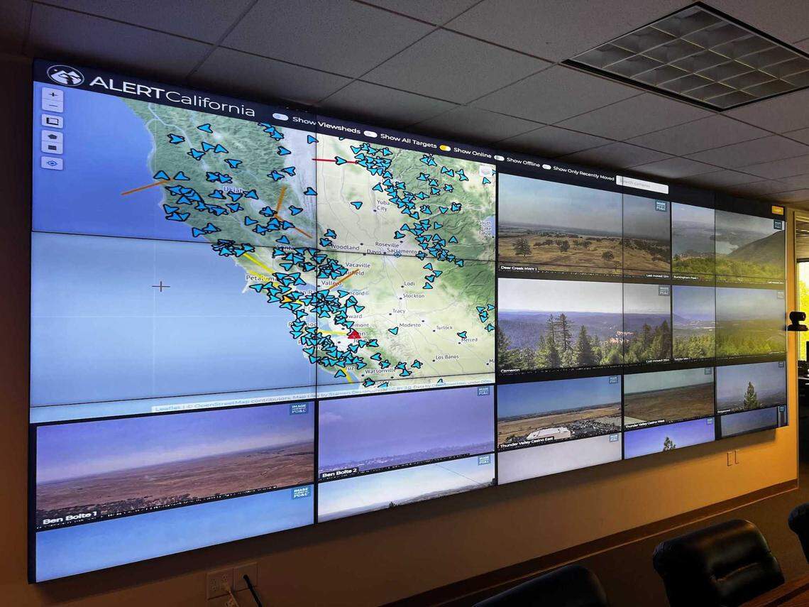 A wall of video feeds shows multiple live-streamed cameras from the AlertCalifornia camera network at Cal Fire’s command and control center in Sacramento in August 2022. A new artificial intelligence tool, developed by AlertCalifornia and Cal Fire, scans for signs of smoke in over 1,000 camera feeds throughout the state.